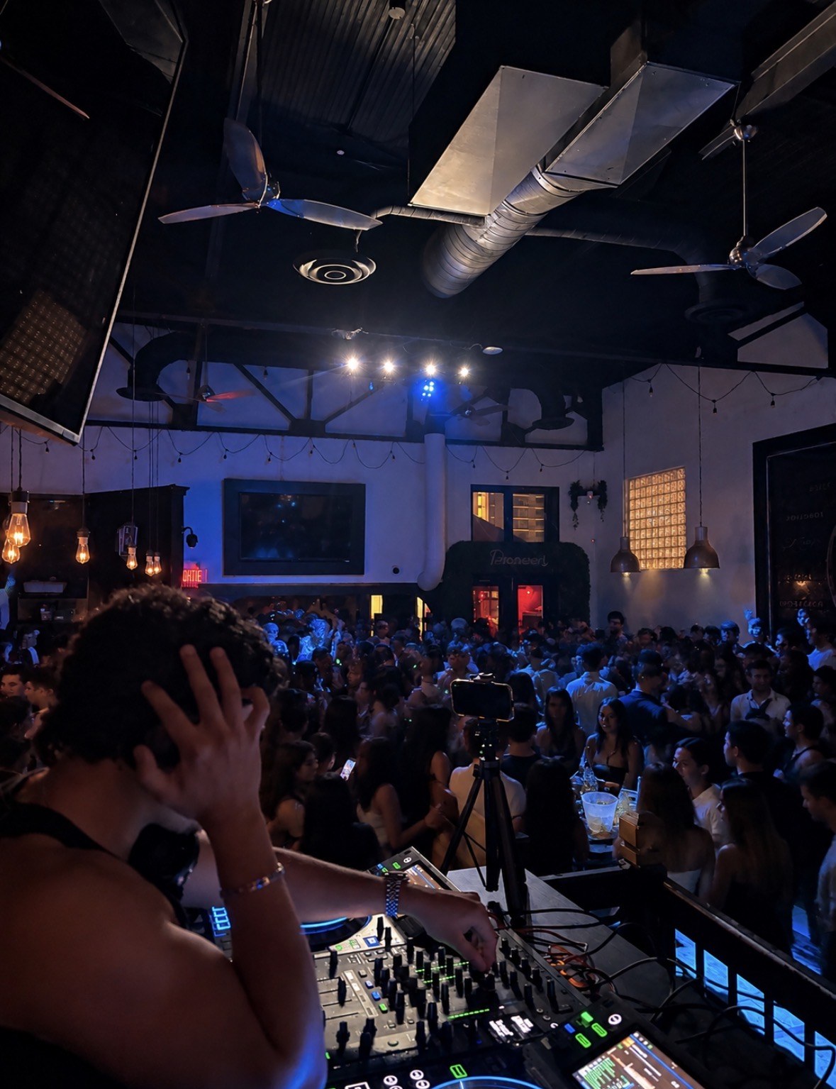 DJ mixing beside the crowd