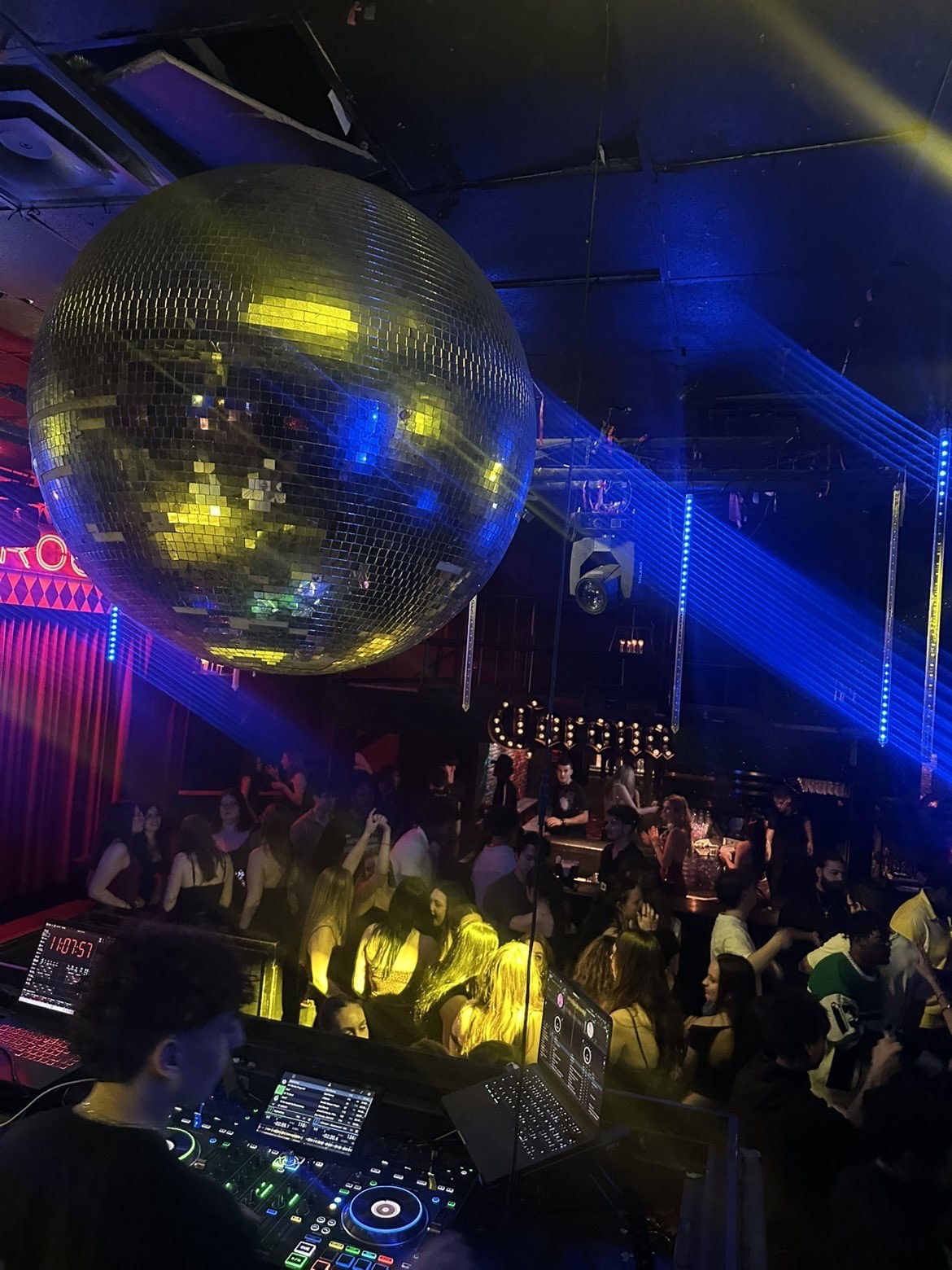 Dance floor beneath a large disco ball